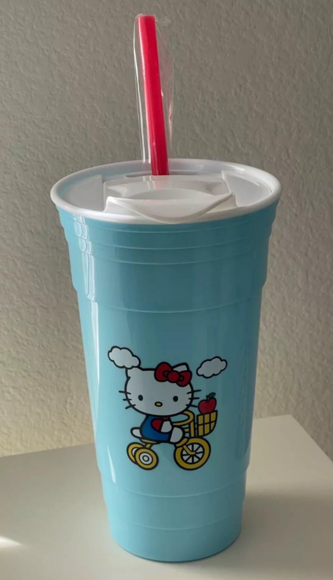 Hello Kitty on Bike Plastic Blue Tumbler With Lid and Straw Holds 32 Oz Sanrio