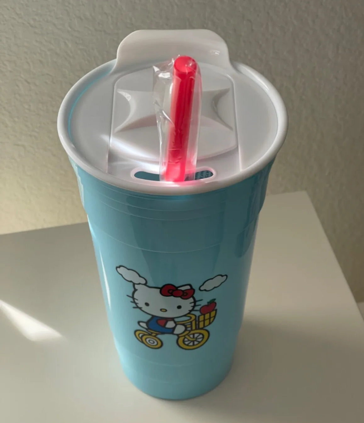 Hello Kitty on Bike Plastic Blue Tumbler With Lid and Straw Holds 32 Oz Sanrio